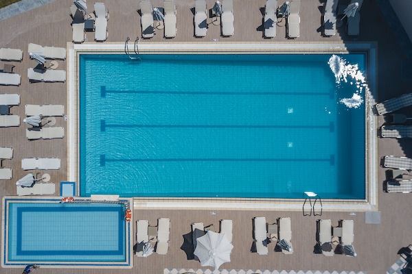 Outdoor pool, pool umbrellas, sun loungers