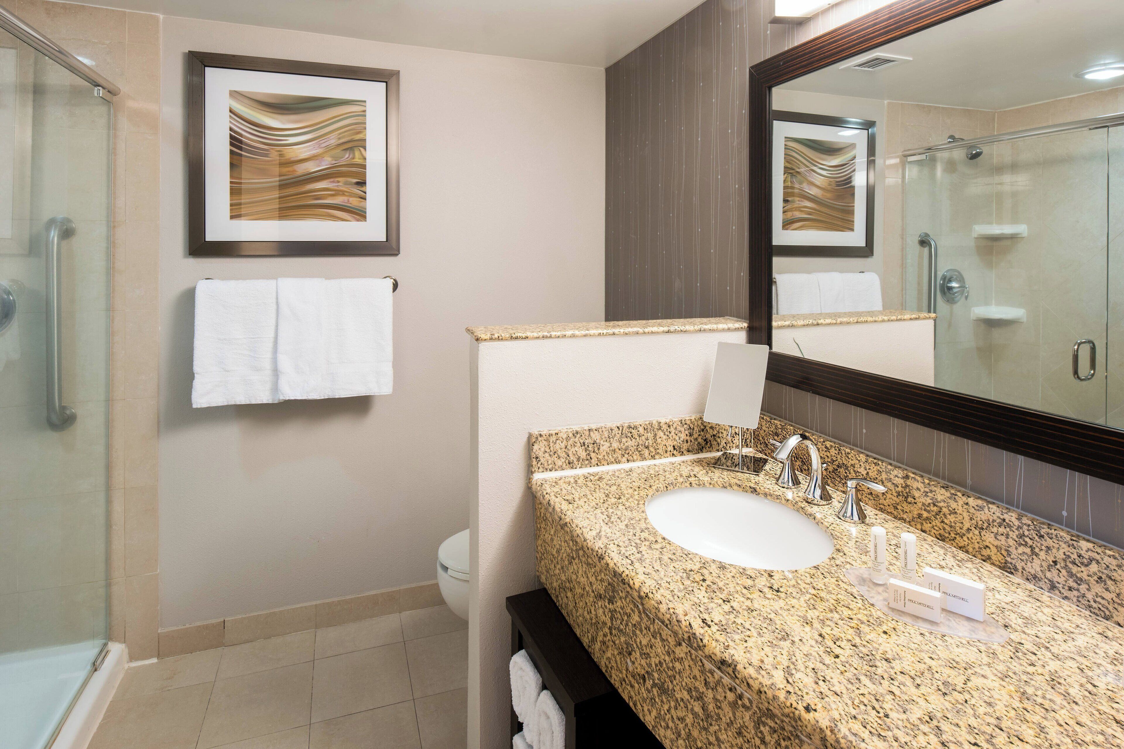 designer toiletries, hair dryer, towels, soap