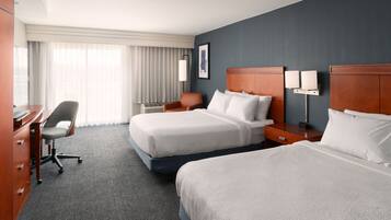 Hypo-allergenic bedding, desk, laptop workspace, blackout curtains