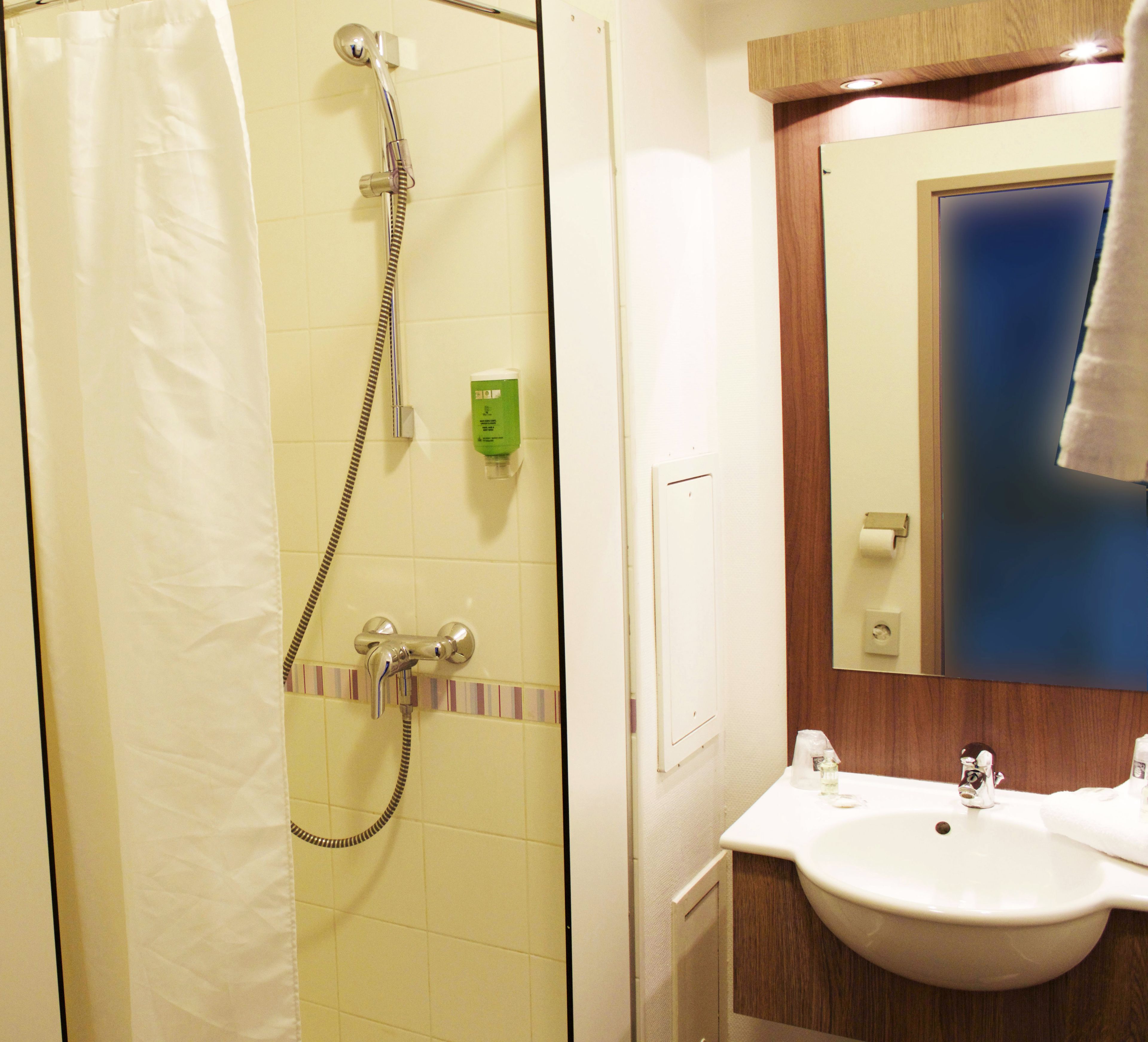 shower, rainfall showerhead, hair dryer, towels