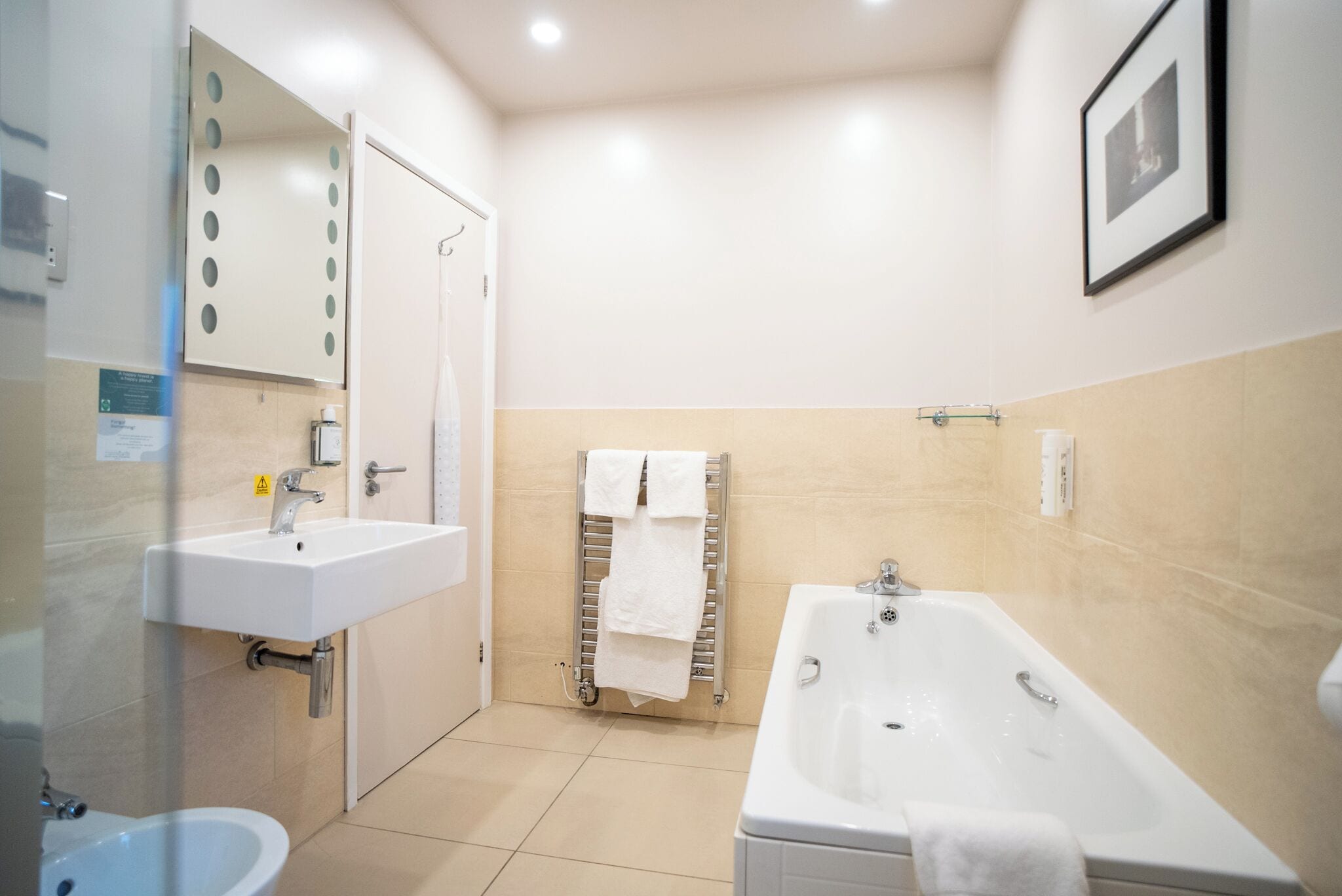 A bathroom with a sink, bathtub, and toilet.
