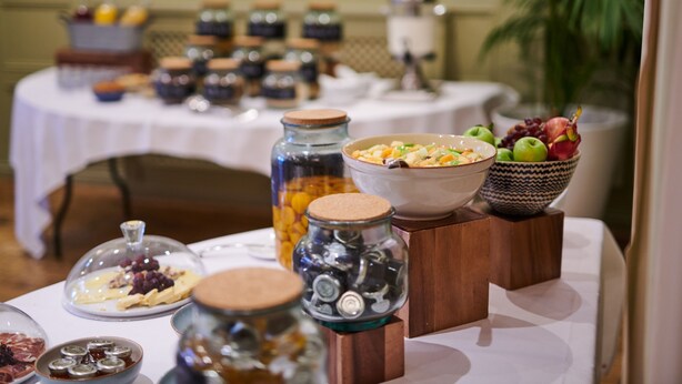 A buffet table with various food items and condiments. - County Hotel Chelmsford (Chelmsford)