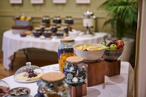 A buffet table with various food items and condiments. - County Hotel Chelmsford (Chelmsford)