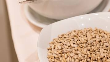 Three bowls of different food items on a table.