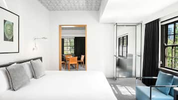 Deluxe Suite, 1 King Bed | Pillowtop beds, minibar, in-room safe, desk