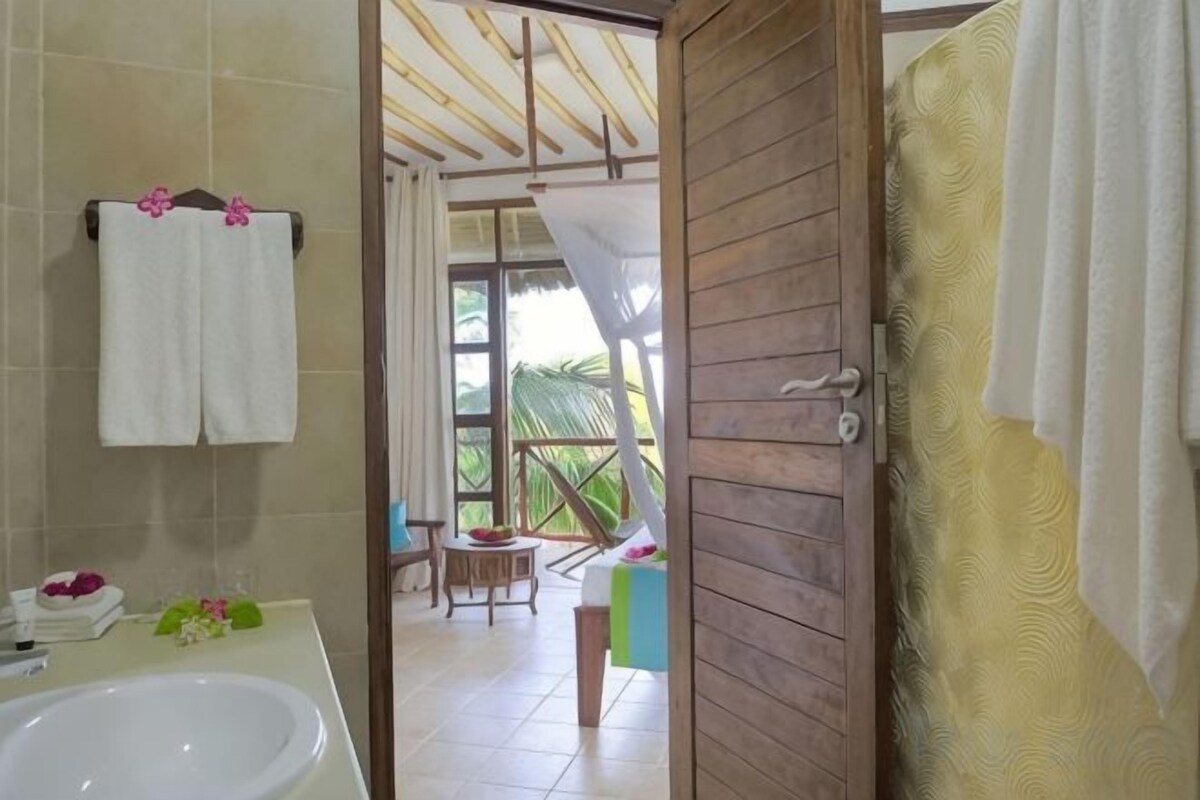 Bathroom | Shower, rainfall showerhead, hair dryer, towels