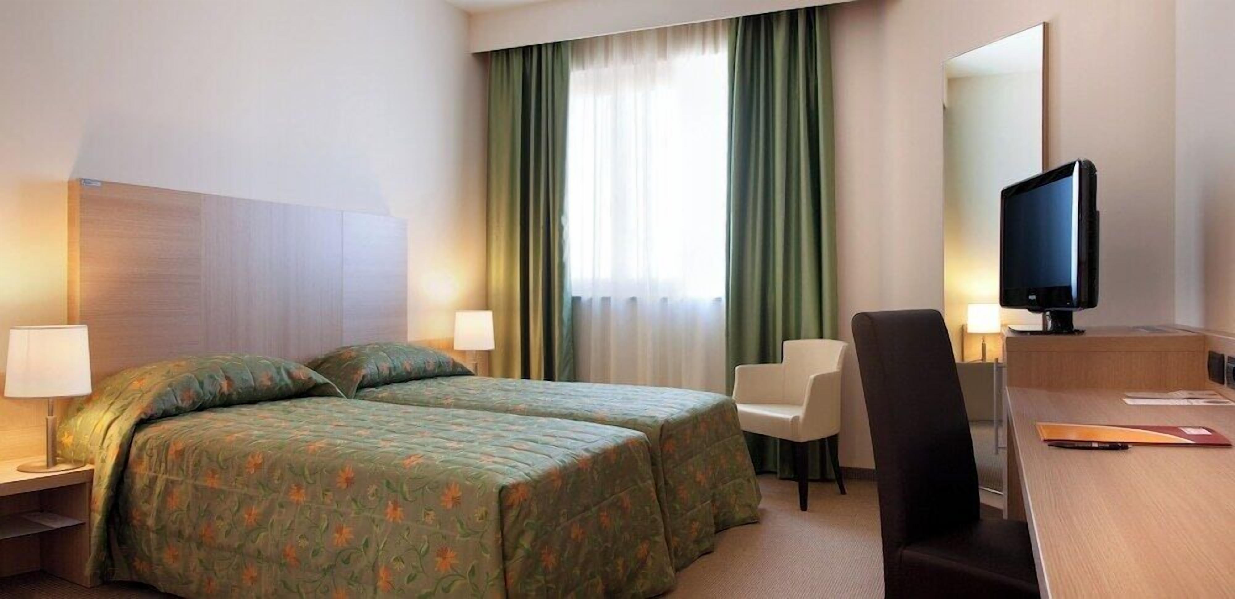 Premium bedding, down comforters, minibar, in-room safe