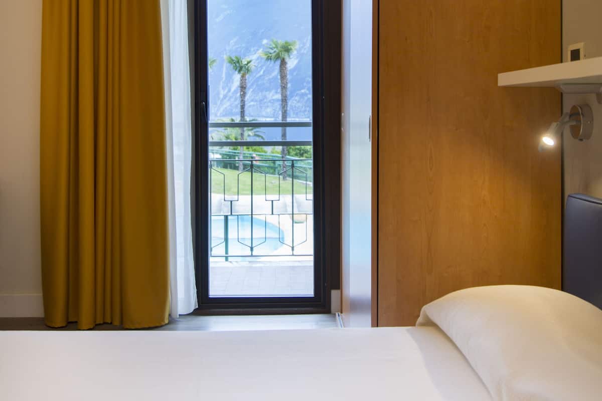Standard Triple Room, Lake View | Minibar, in-room safe, desk, free WiFi