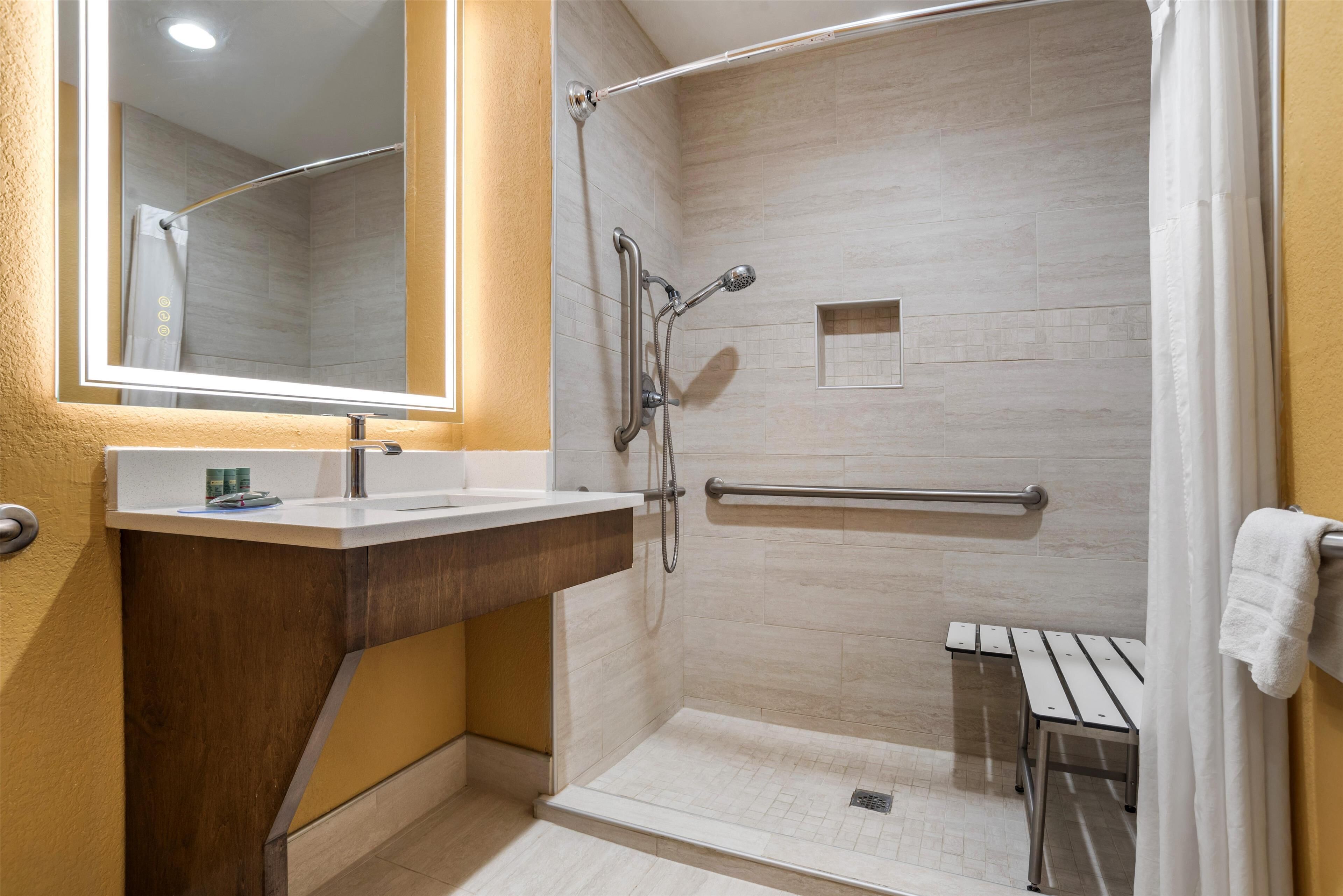 standard room, 2 queen beds, accessible, refrigerator & microwave | bathroom | combined shower/bathtub, hair dryer, towels