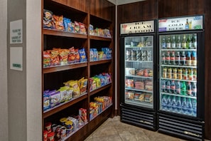A snack and beverage vending area with a variety of snacks and ice cold beer options.