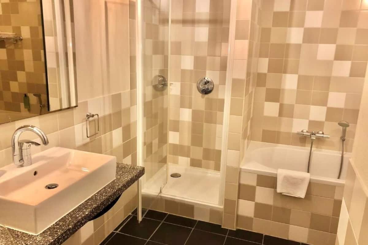 separate bathtub and shower, free toiletries, hair dryer, towels