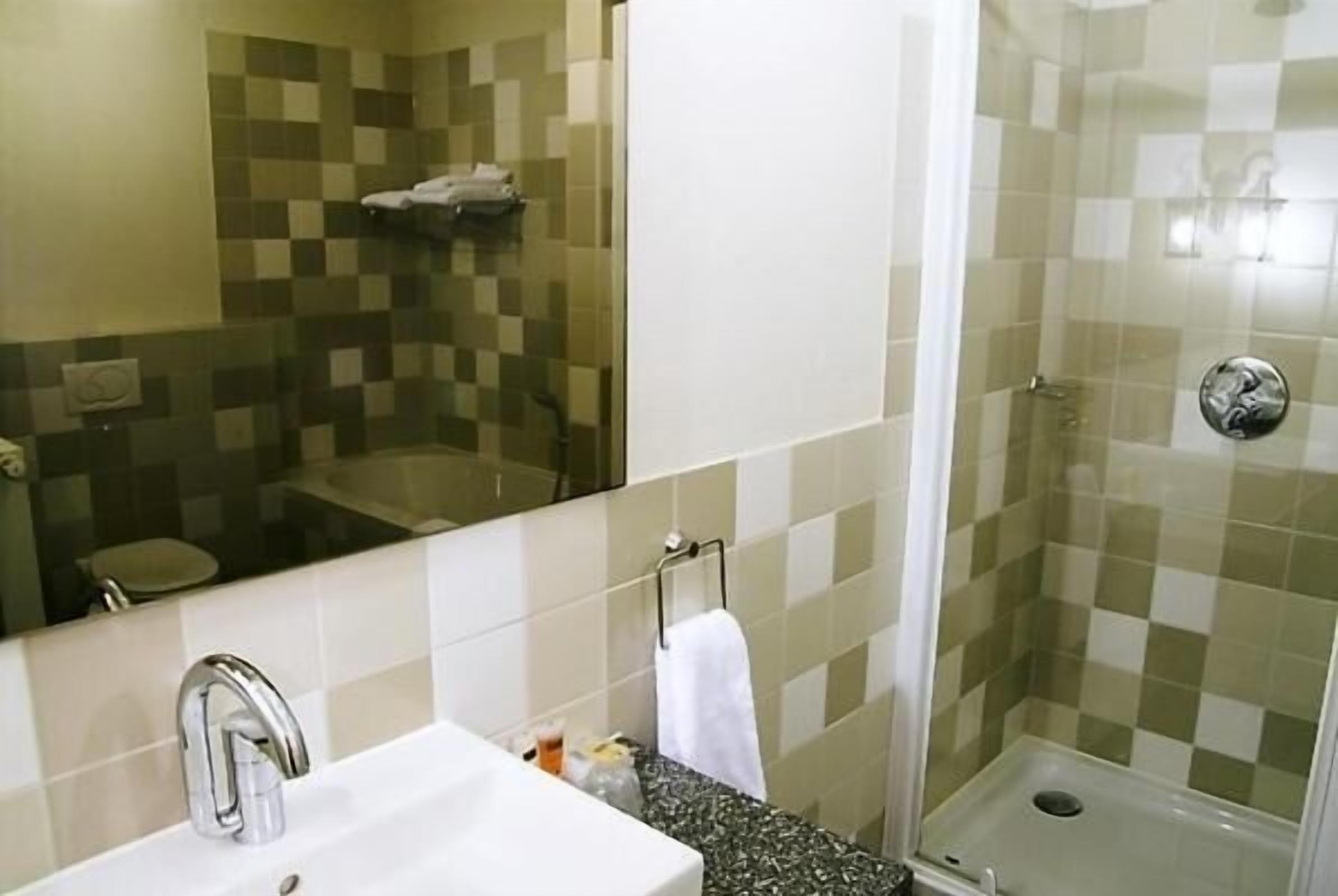 separate bathtub and shower, free toiletries, hair dryer, towels