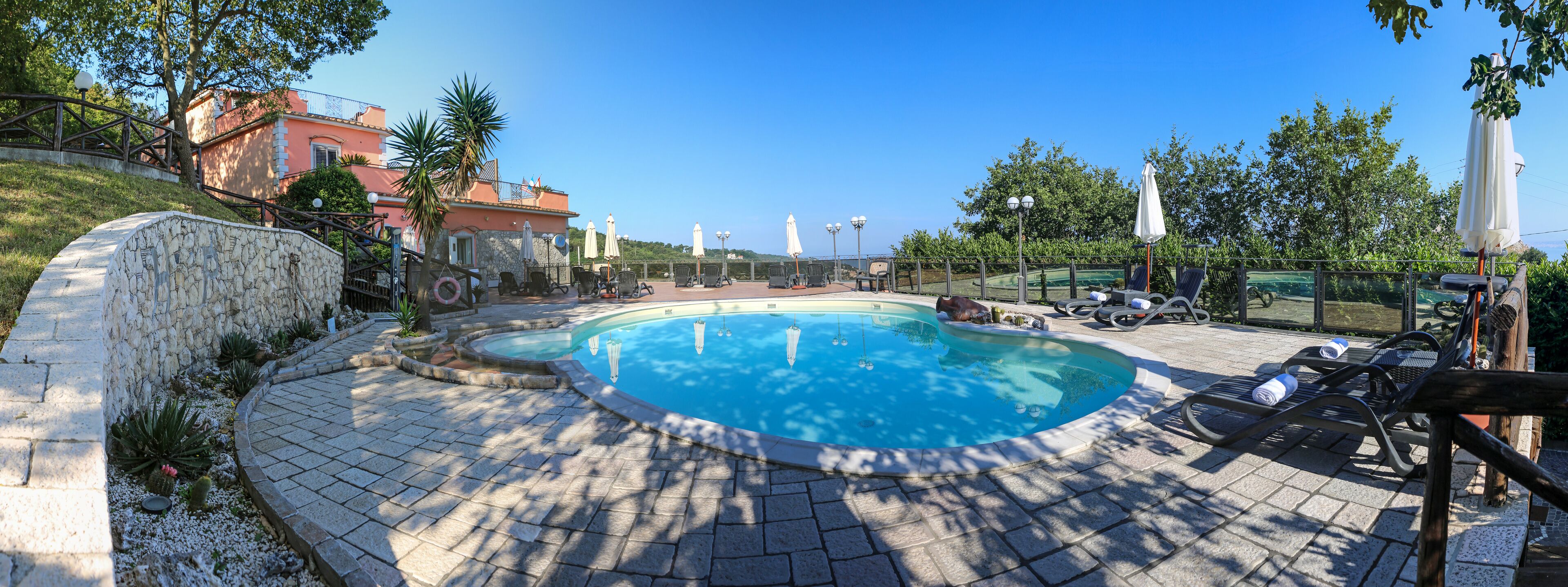 seasonal outdoor pool, open 9:00 am to 7:00 pm, pool loungers