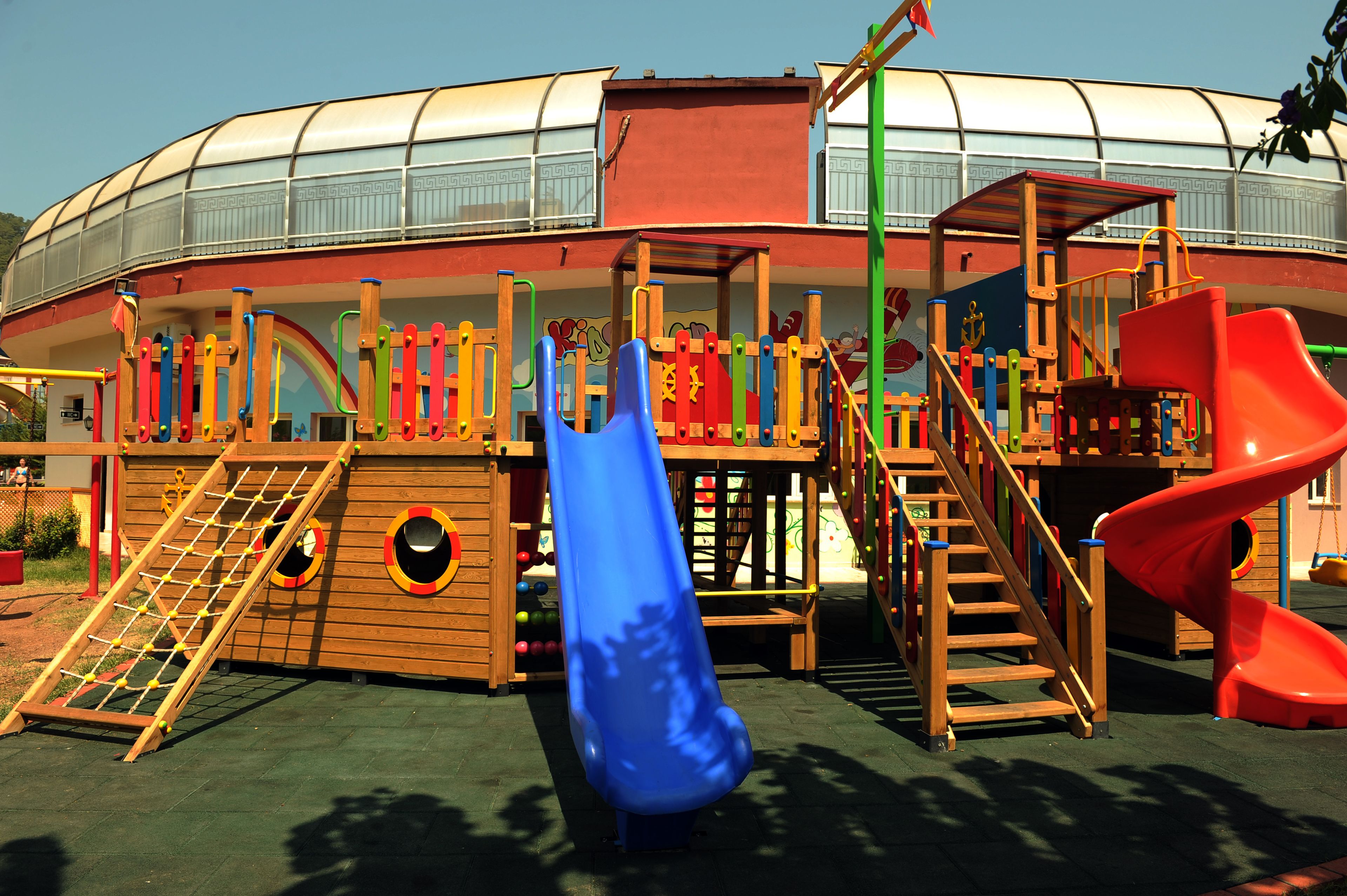 A playground with slides and climbing structures.