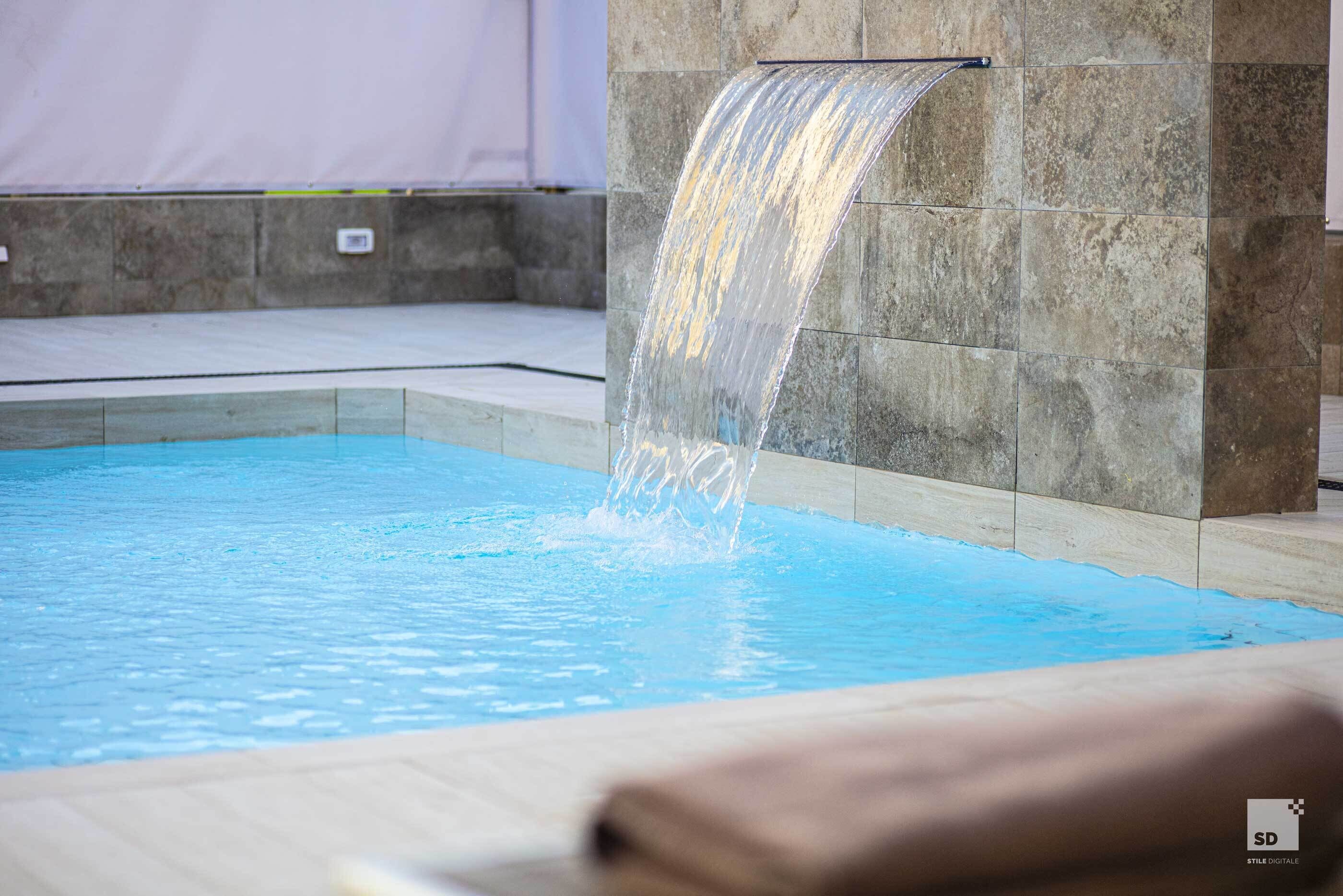 Seasonal outdoor pool, open 10:00 AM to 6:00 PM, pool umbrellas