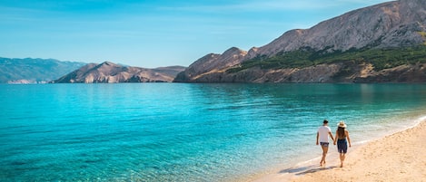 On the beach, sun loungers, beach umbrellas, beach towels