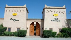 A building with two towers, each labeled "Hotel Restaurant."