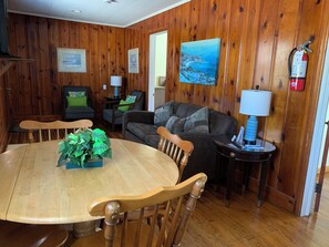 Deluxe Suite, 2 Bedrooms, Kitchen, Courtyard Area | Living area | TV - Cape Pines Motel (Buxton)