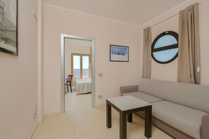 Habitación superior | Zona de estar | Una televisión LCD