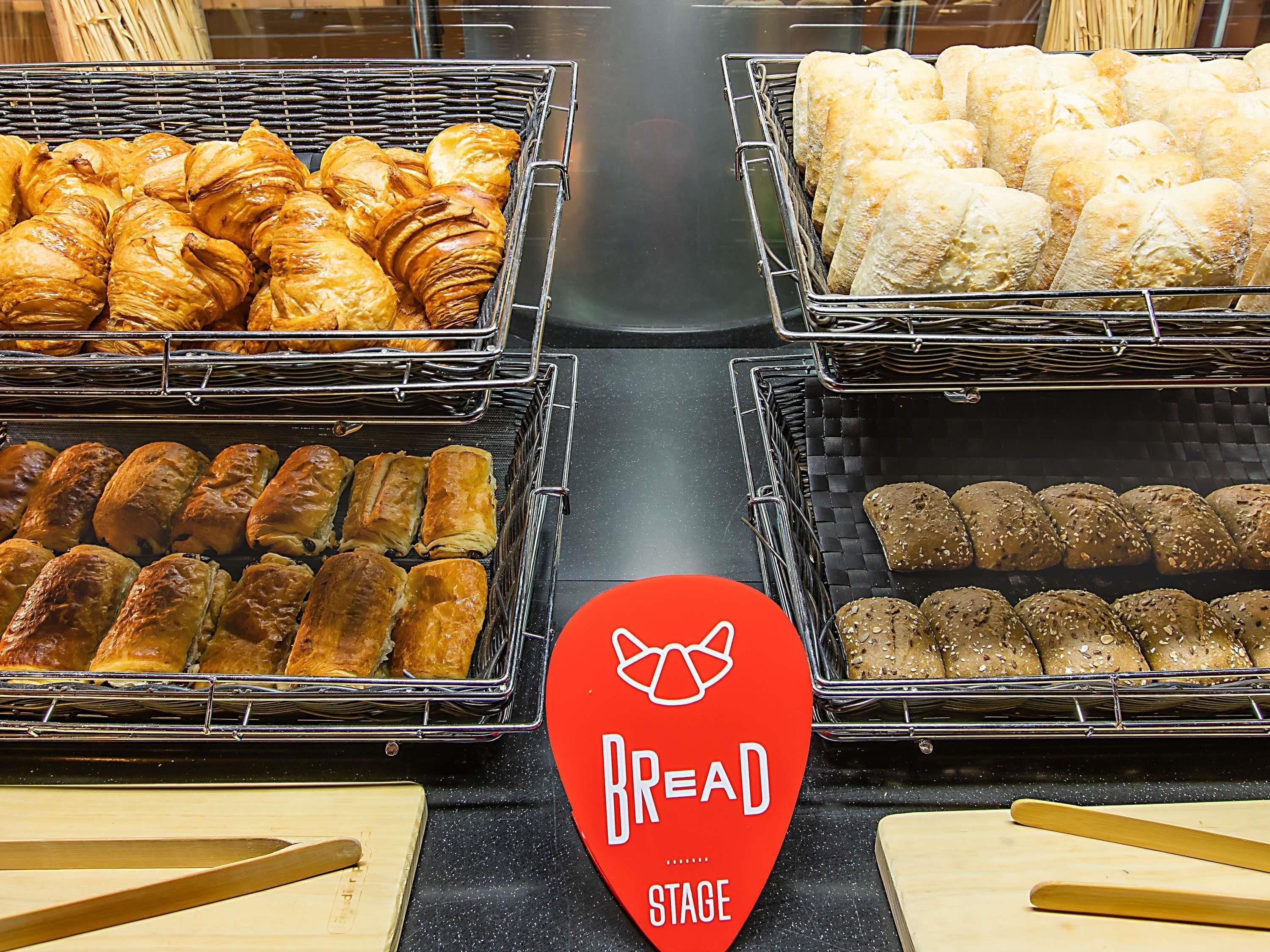 A bakery display with various baked goods.