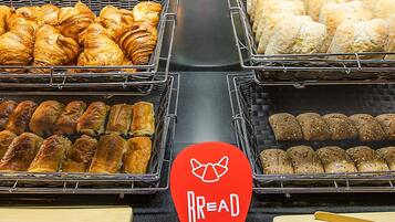A bakery display with various baked goods.