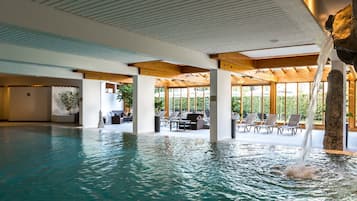 Indoor pool, pool umbrellas, pool loungers