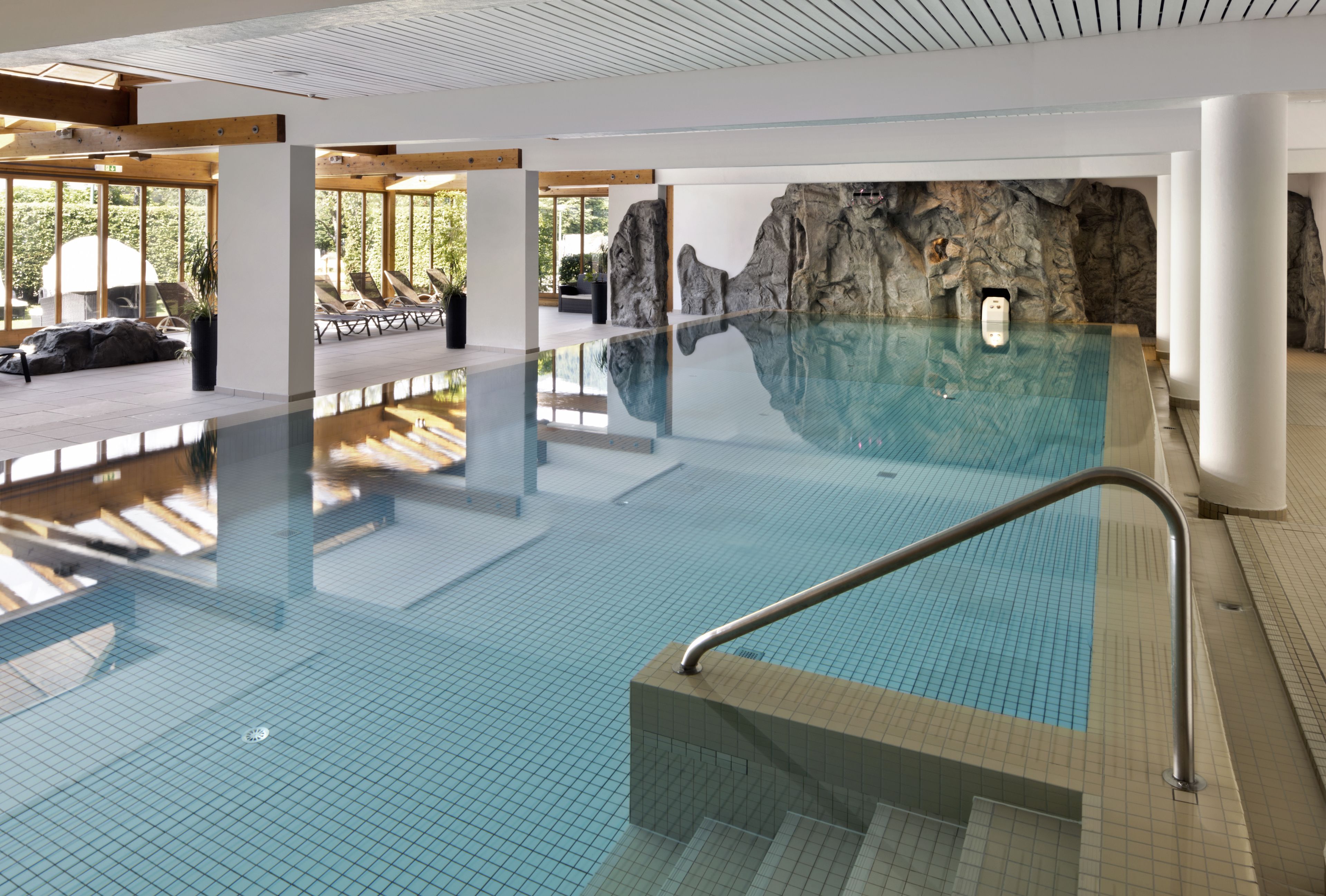 indoor pool, open 7:00 am to 10:00 pm, pool umbrellas, pool loungers