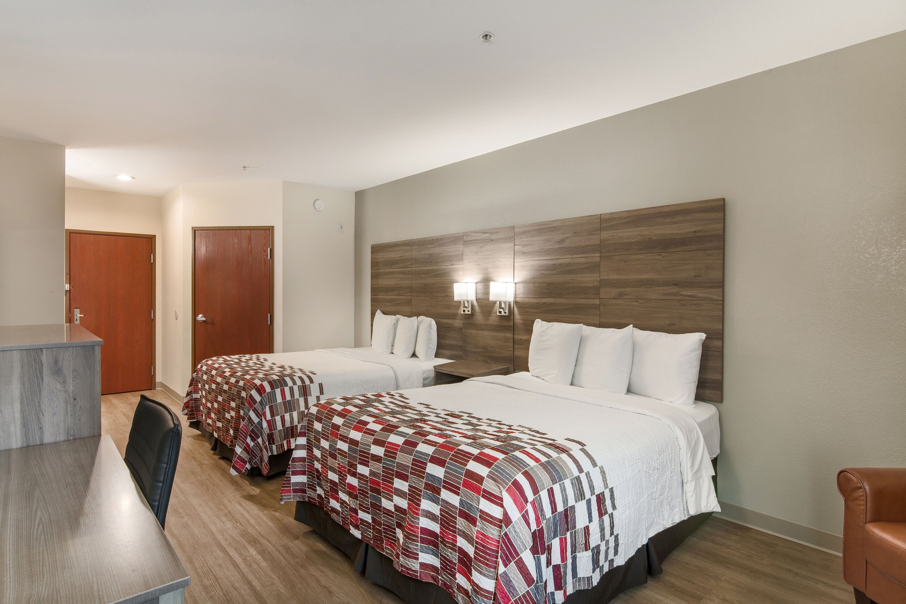 deluxe room, 2 queen beds, non smoking | blackout curtains, iron/ironing board, free cots/infant beds