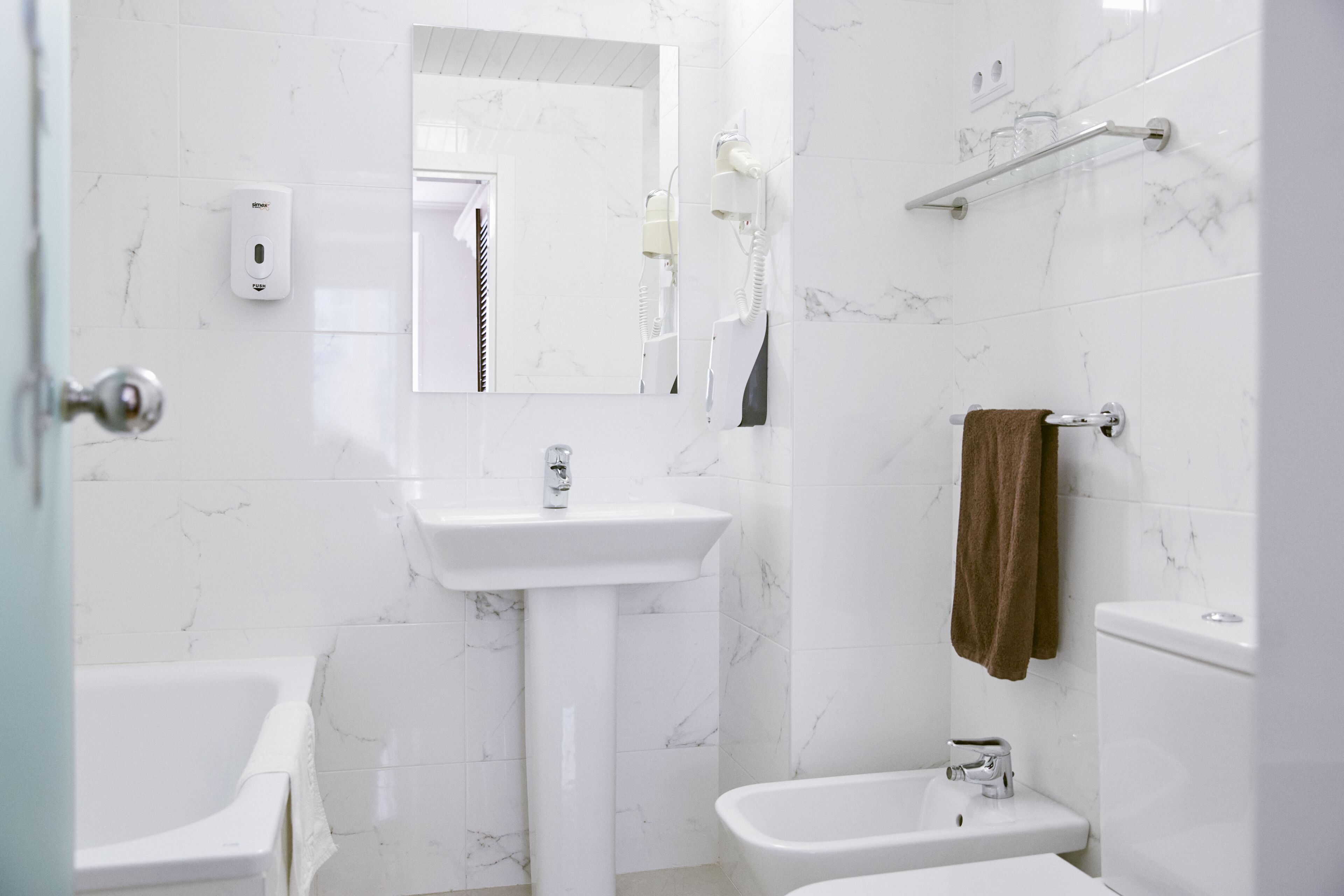 bathtub, eco-friendly toiletries, hair dryer, bidet