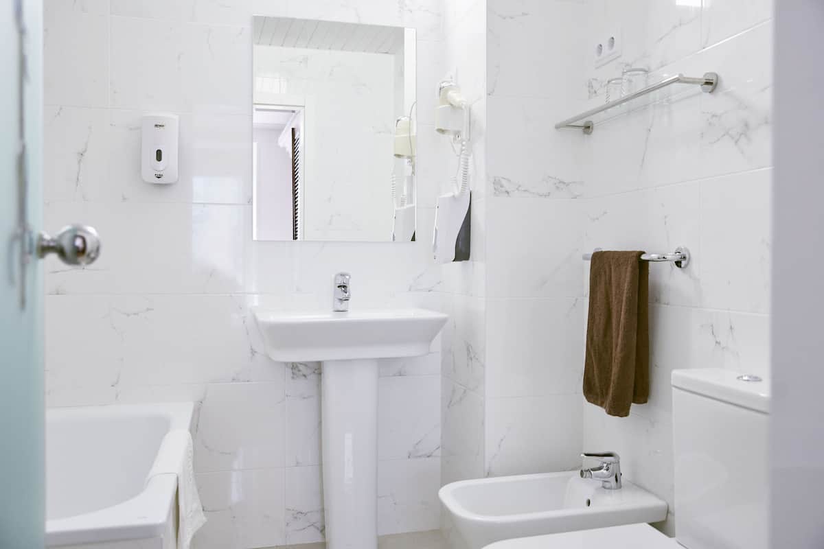 bathtub, eco-friendly toiletries, hair dryer, bidet