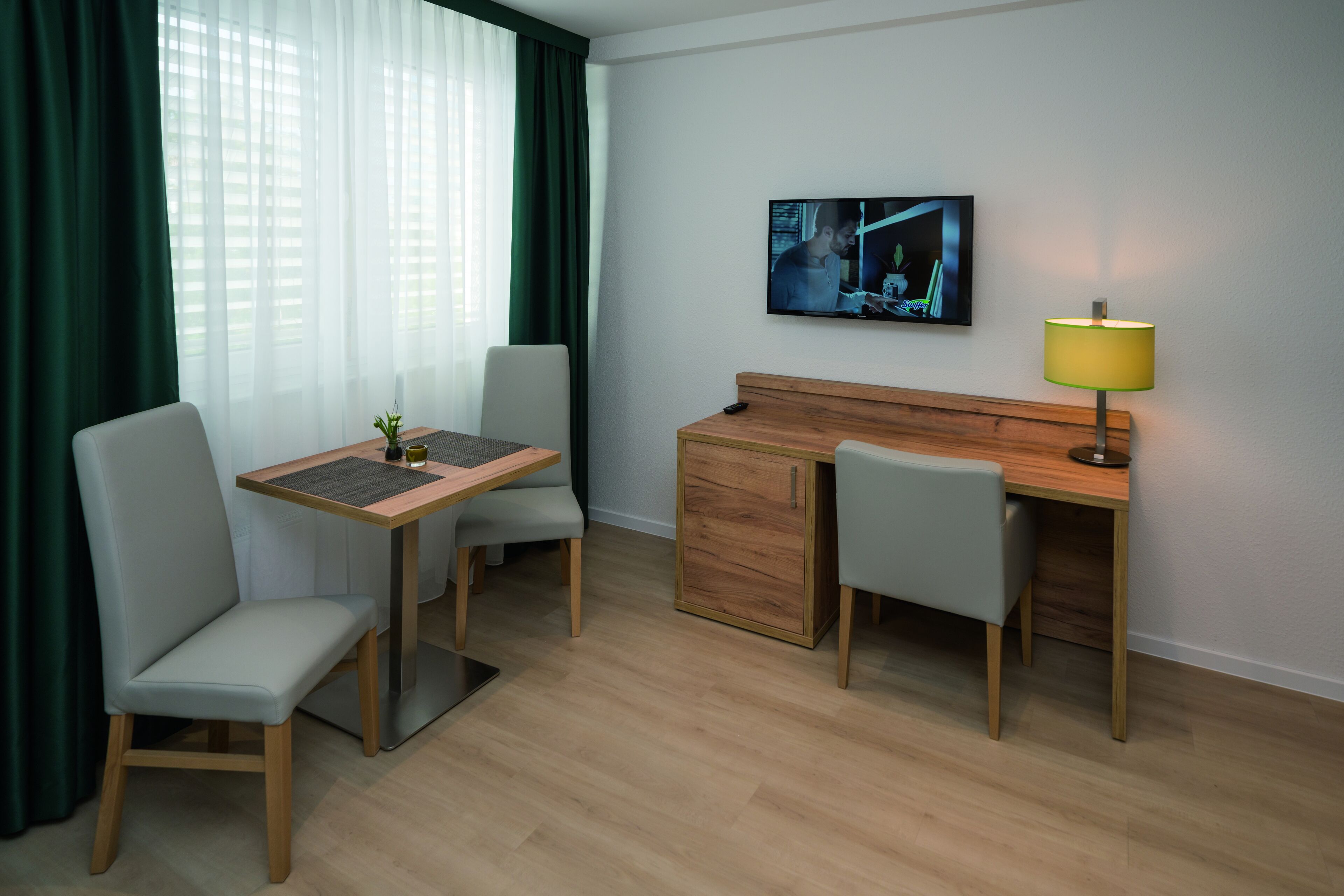 apartment muensterstrasse | living area | 32-inch tv with satellite channels
