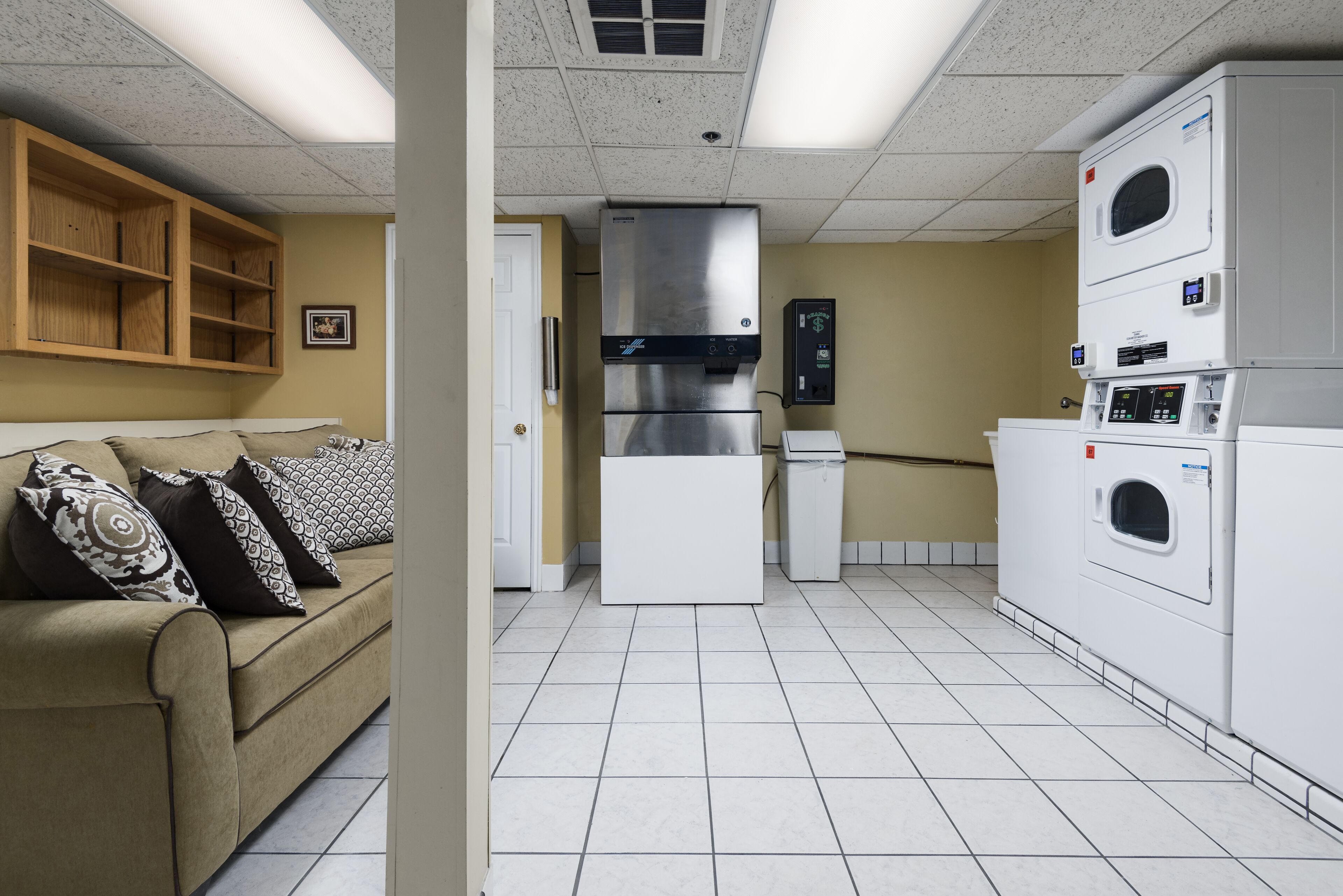 A compact kitchen with a built-in refrigerator, a microwave, and a dishwasher.