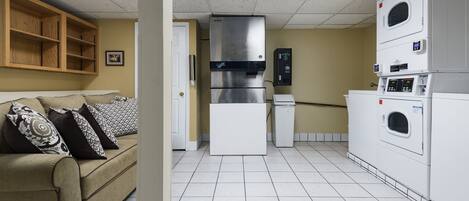A compact kitchen with a built-in refrigerator, a microwave, and a dishwasher.