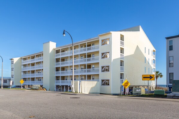 A multi-story hotel with balconies and a beach view. - Windy Shores II (North Myrtle Beach)