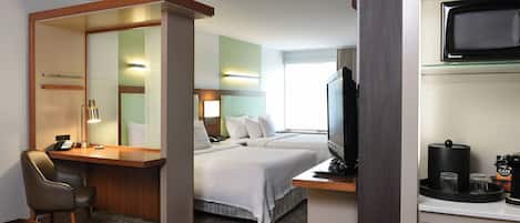 Down comforters, pillowtop beds, desk, blackout drapes