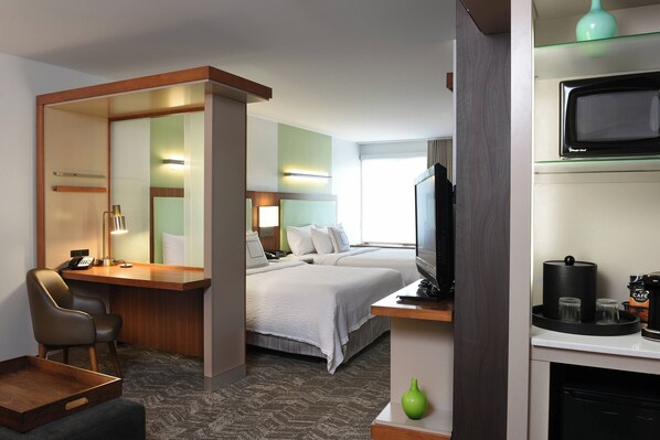 Down comforters, pillowtop beds, desk, blackout drapes