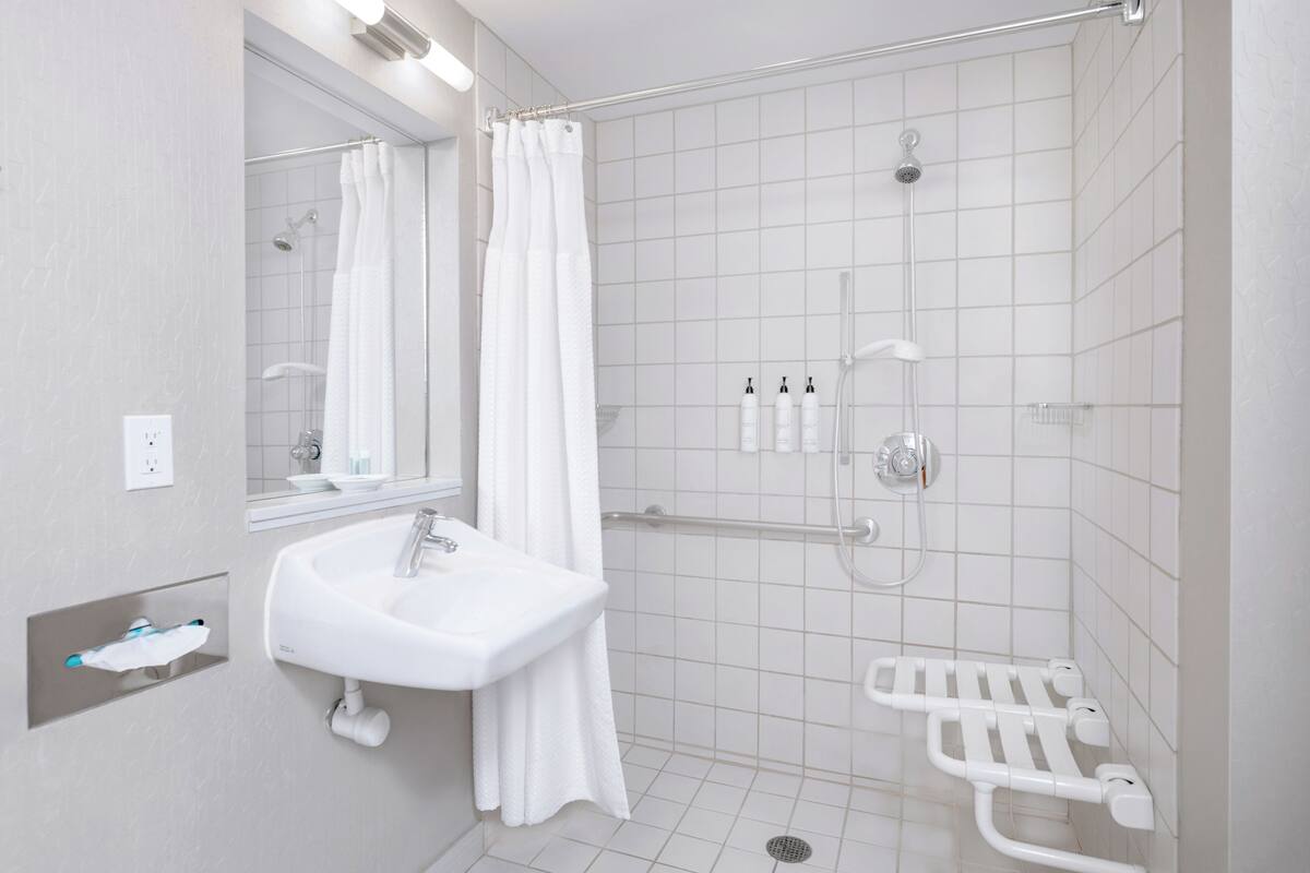 studio, 1 king bed with sofa bed (mobility/hearing access, roll-in shwr) | bathroom | free toiletries, hair dryer, towels