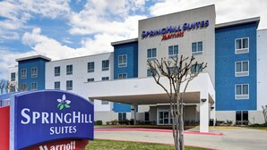 A hotel exterior with a sign for SpringHill Suites Marriott, featuring a modern design with a flat roof and multiple windows. - SpringHill Suites Shreveport-Bossier City/Louisiana Downs (Bossier City)