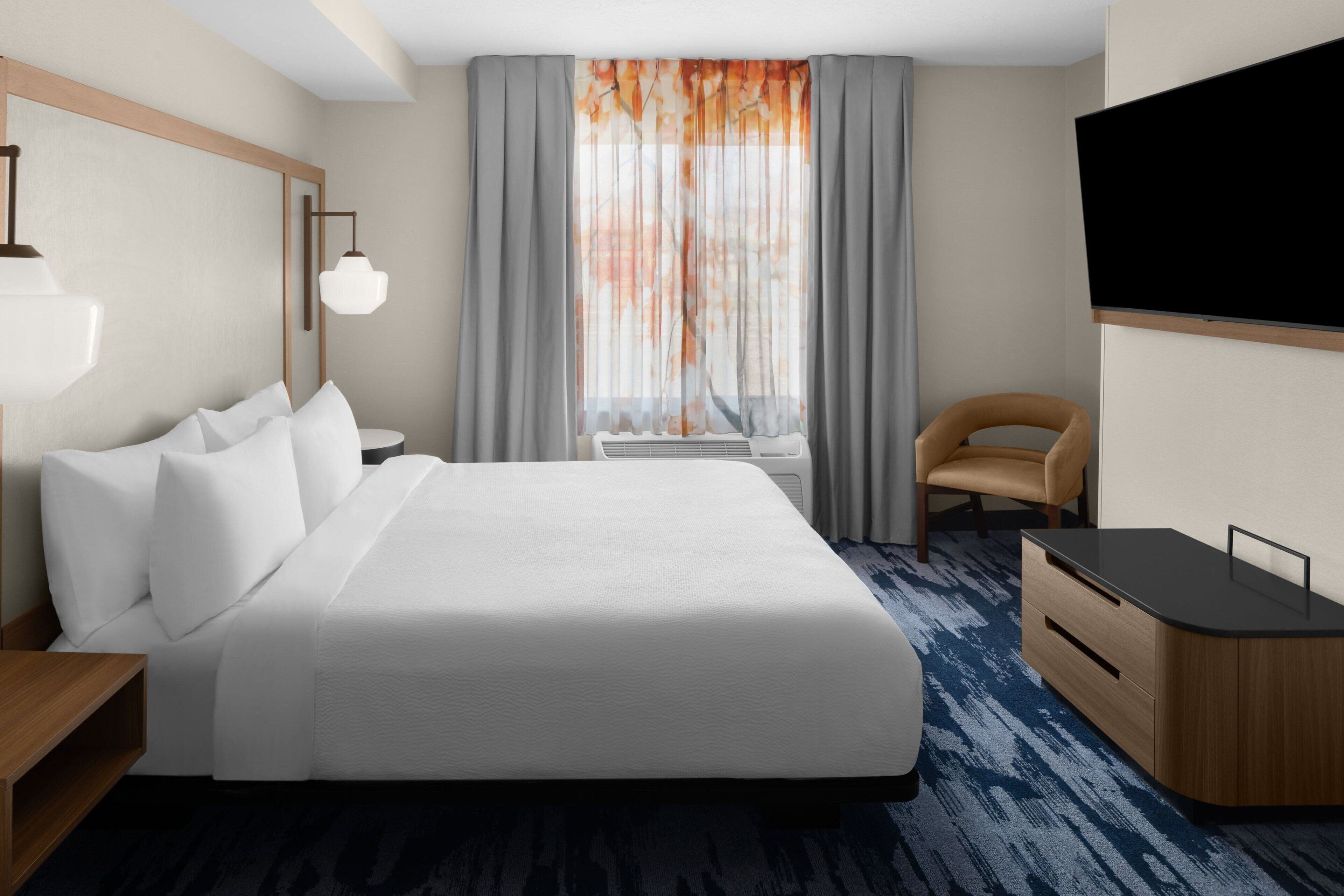 premium bedding, desk, blackout curtains, iron/ironing board