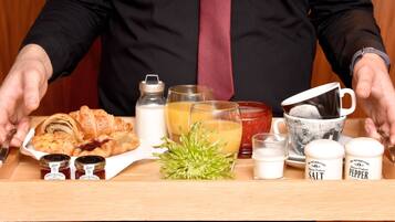 A tray with food items, drinks, and condiments.