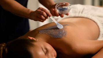A person receiving a treatment on their back.