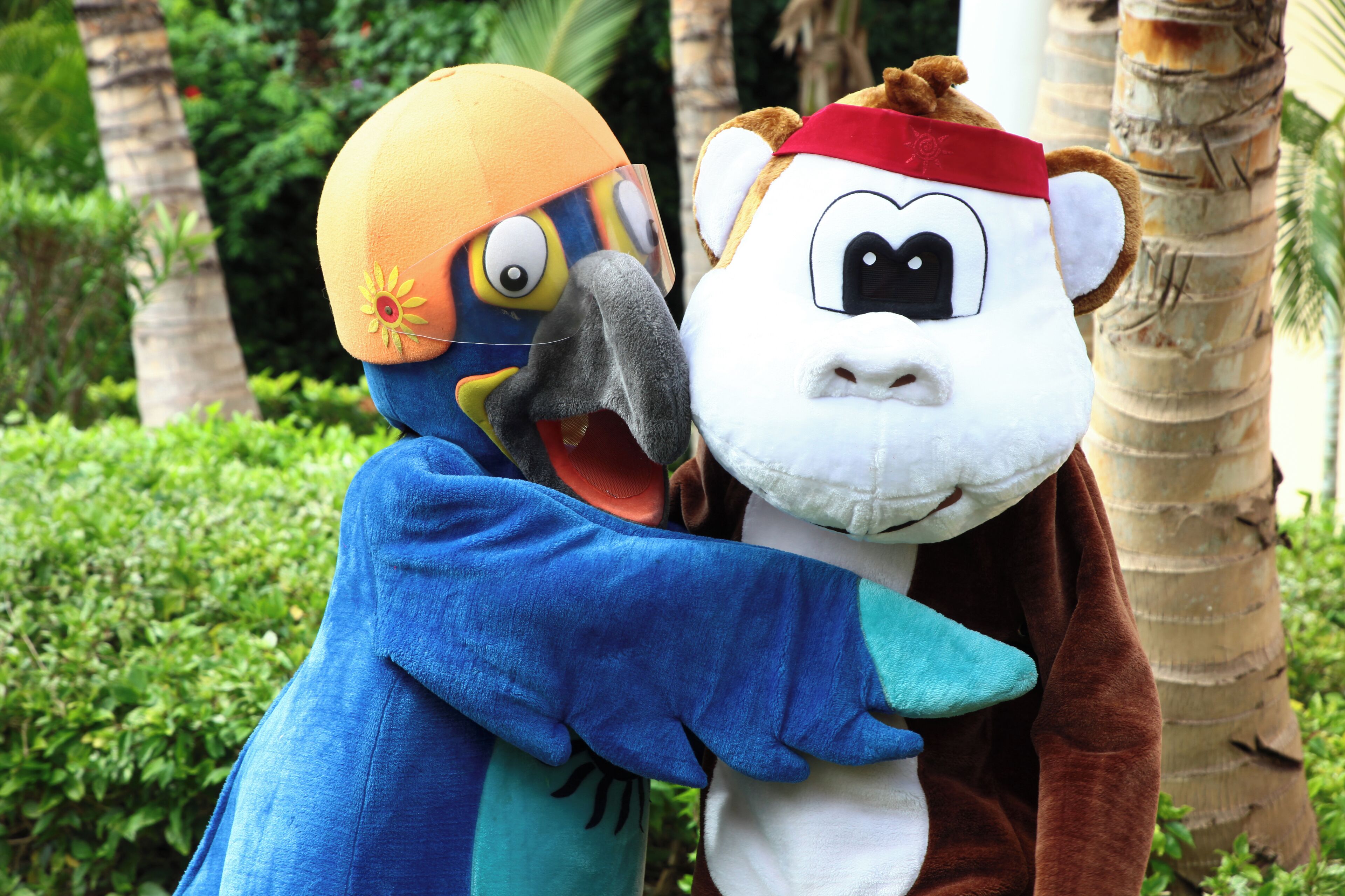 Two characters in costumes hugging each other.