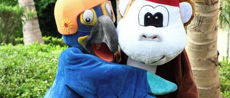 Two characters in costumes hugging each other.