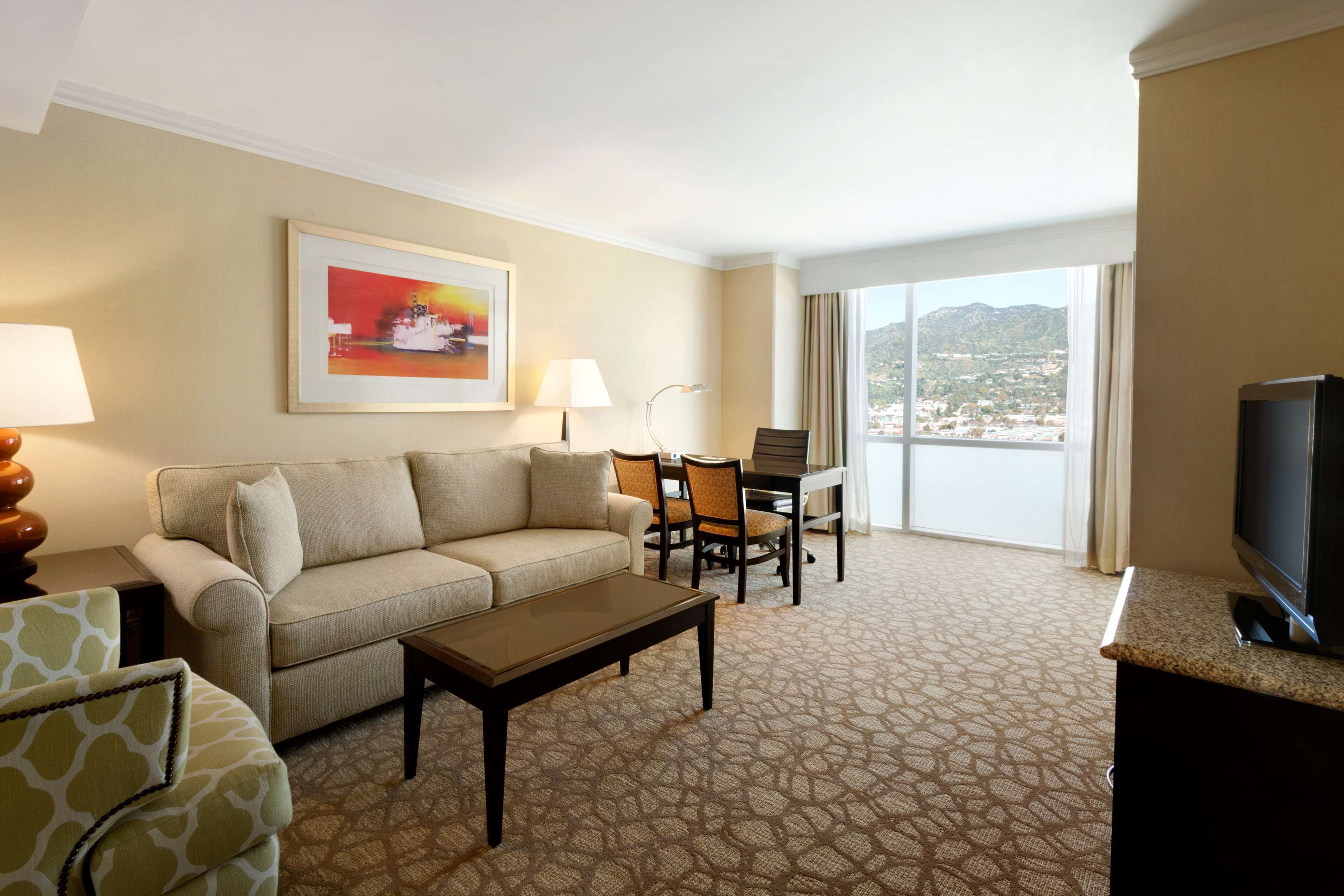 One King Bed, City View, Non-Smoking | Living area | 32-inch LCD TV with satellite channels, TV, first-run movies