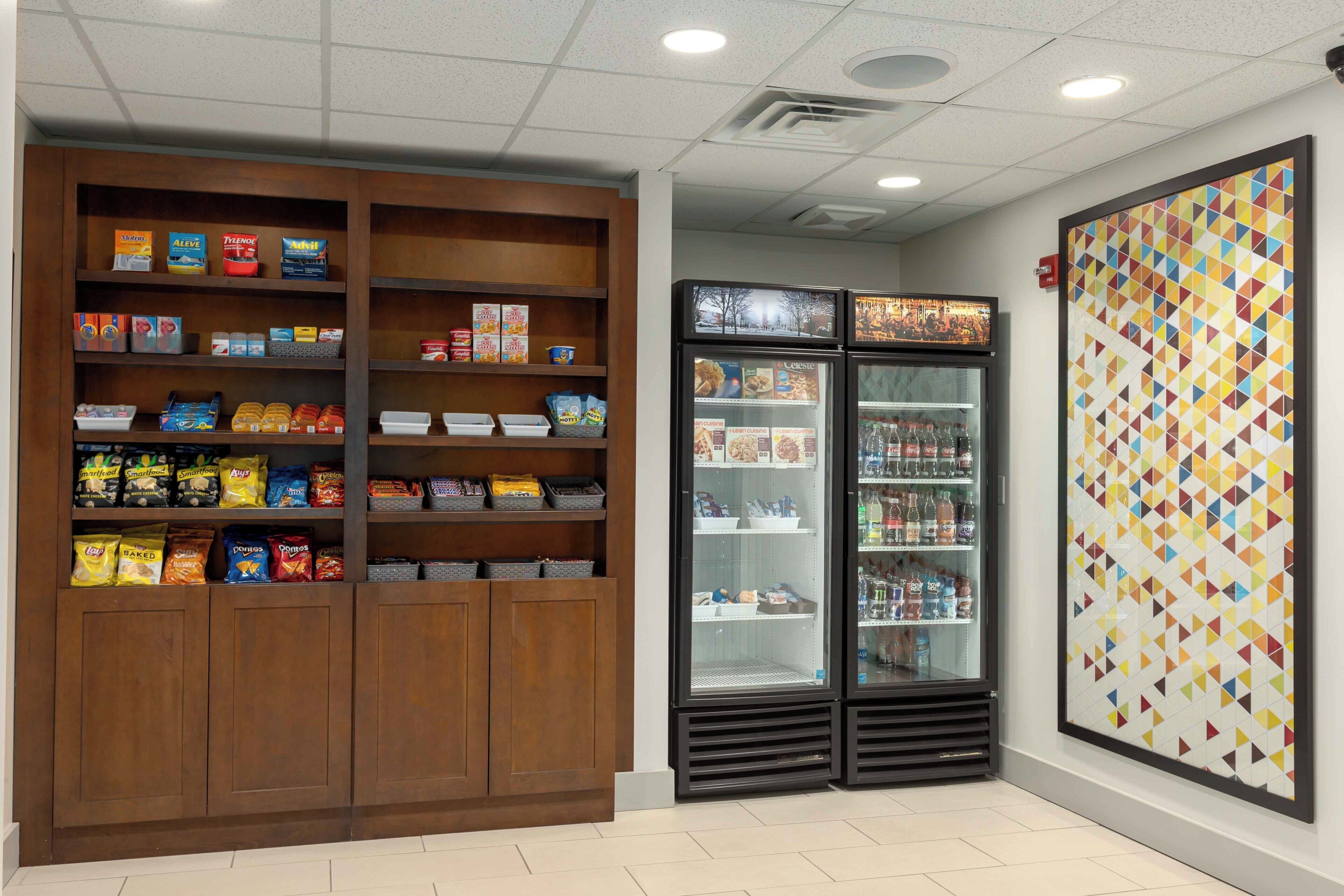 A snack and beverage vending area with various snack options and a refrigerated section.