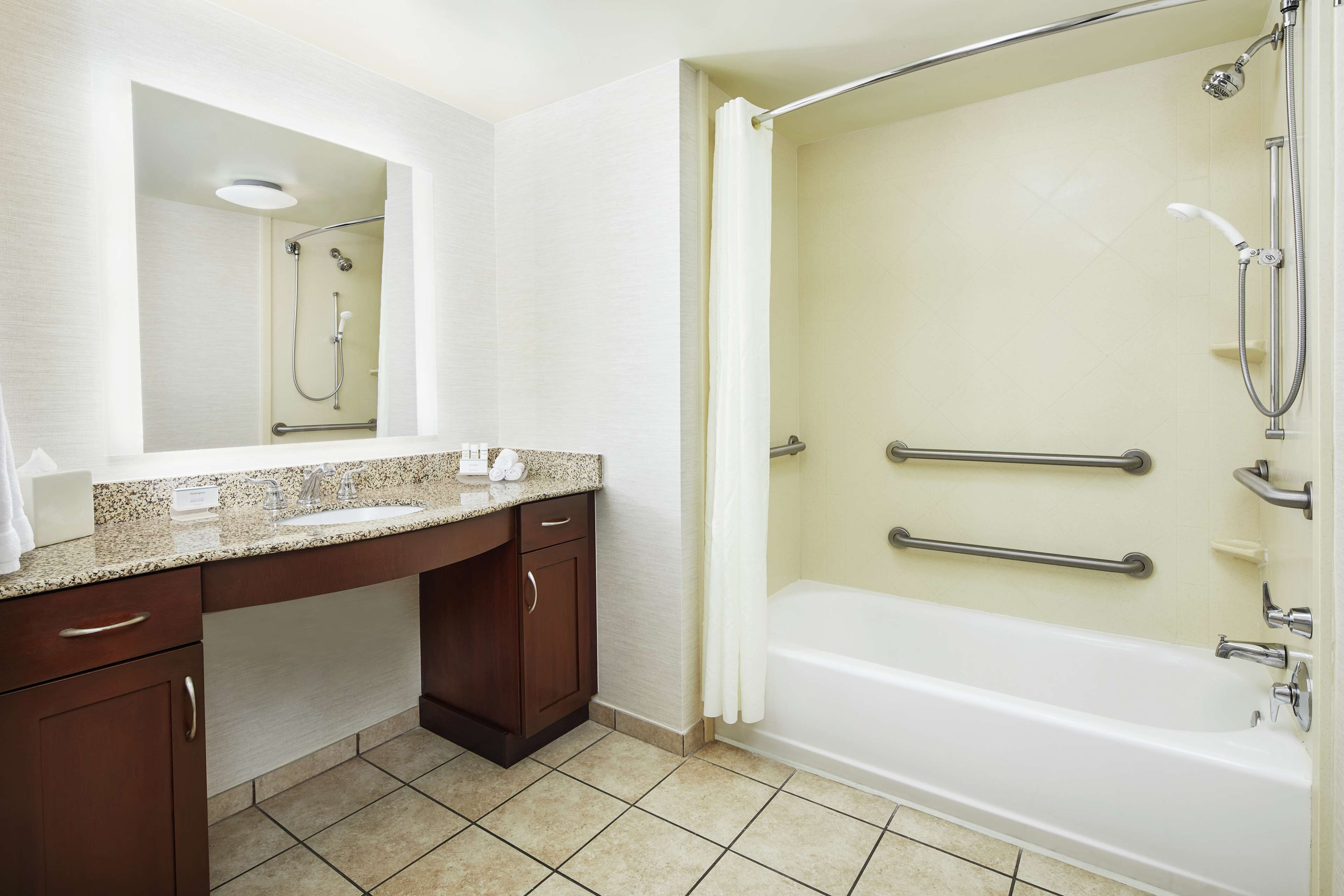suite, 1 king bed, accessible, bathtub | bathroom | combined shower/bathtub, deep-soaking bathtub, hair dryer, towels