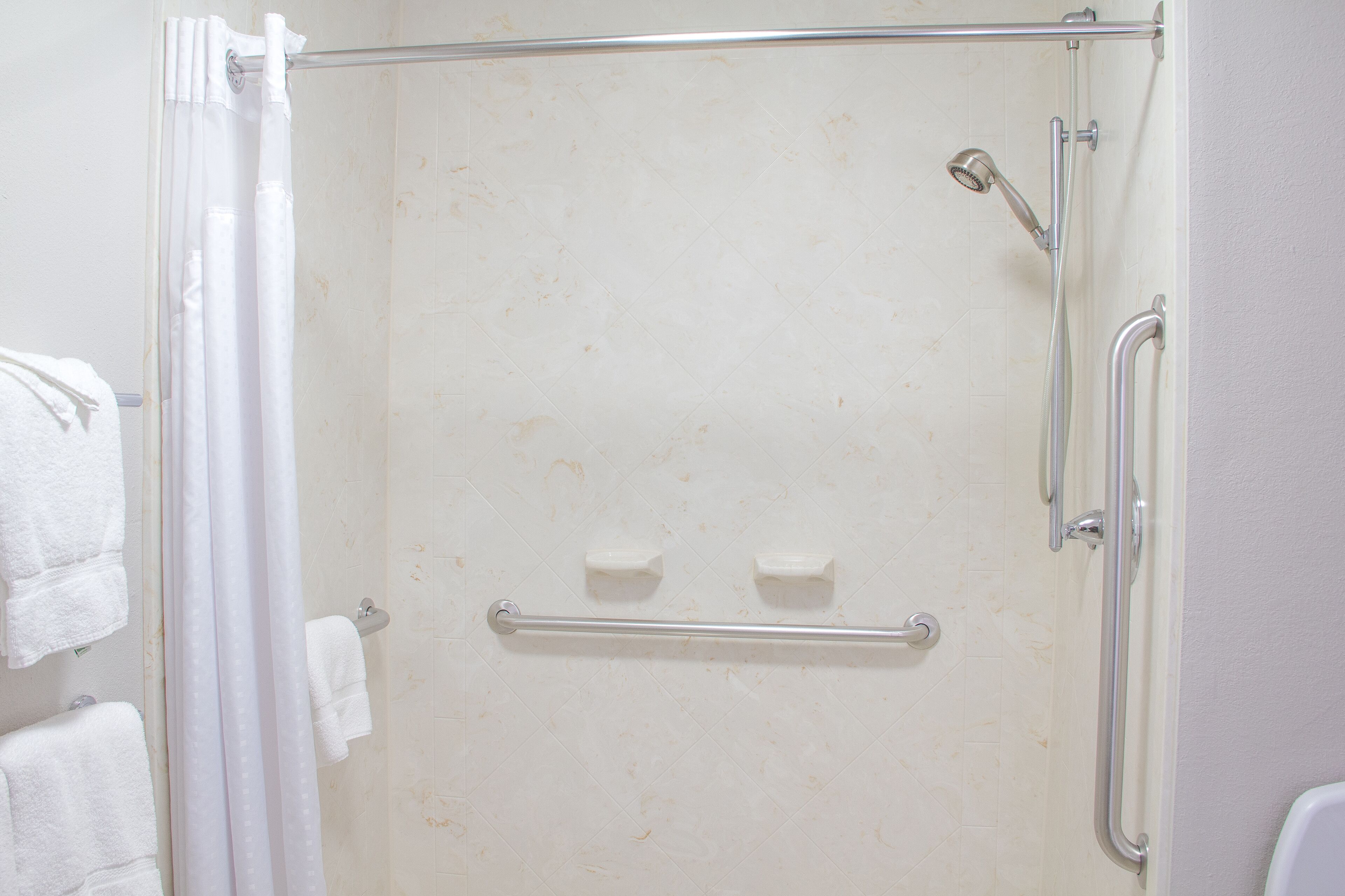 designer toiletries, hair dryer, towels