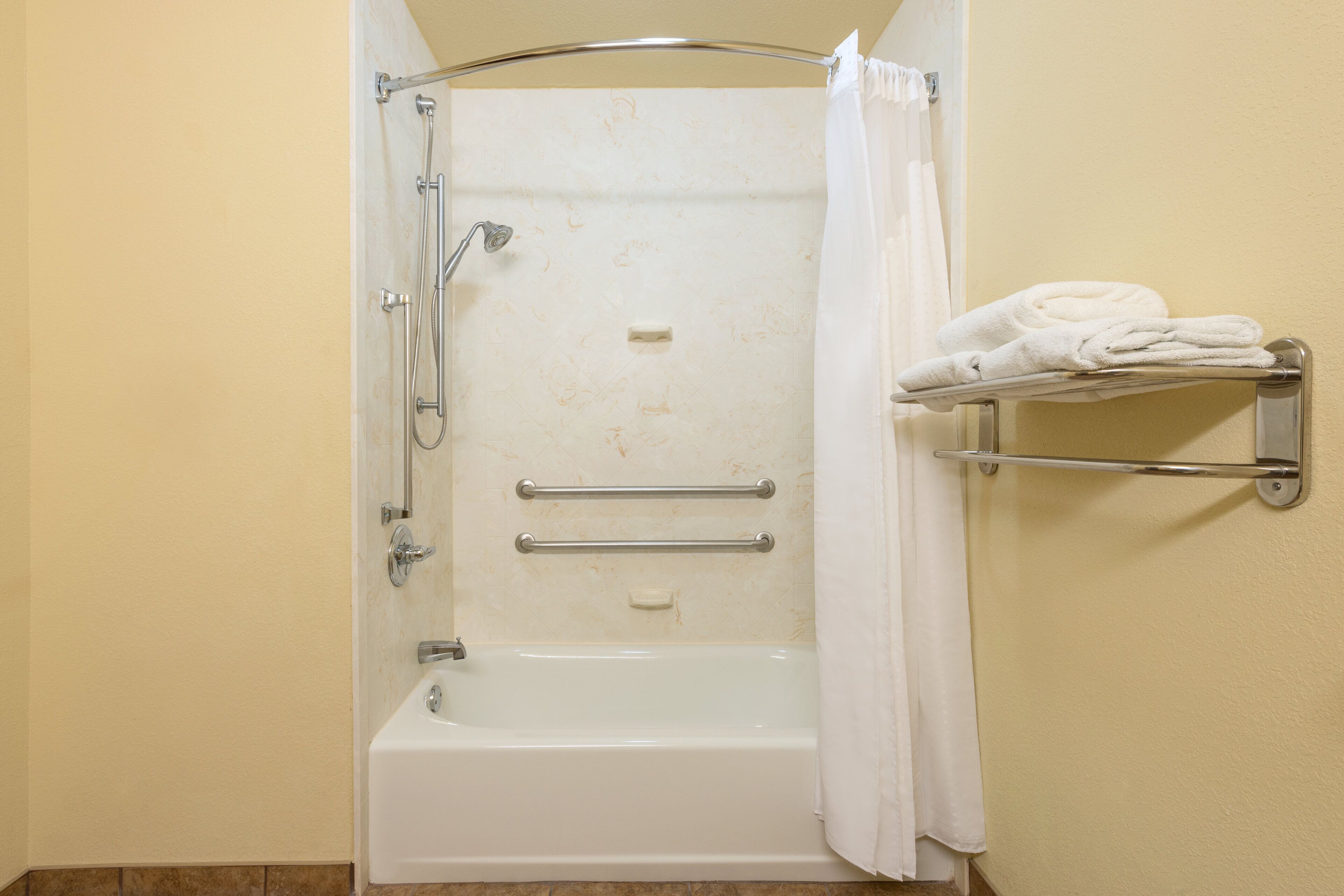 Designer toiletries, hair dryer, towels