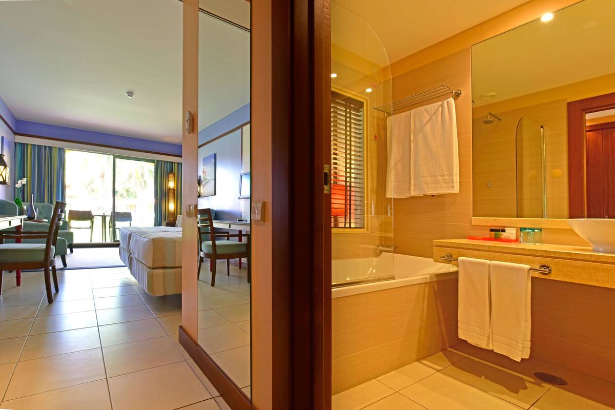 double or twin room, pool view | minibar, in-room safe, desk, blackout curtains