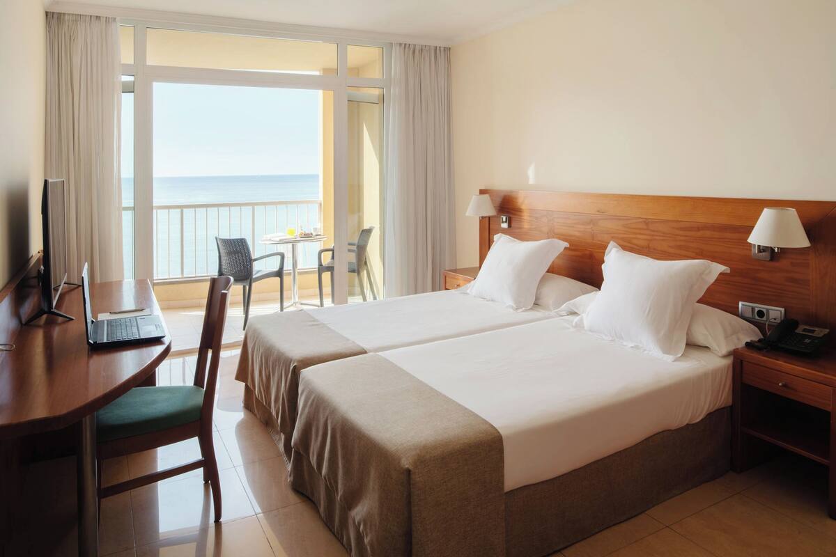 Premium bedding, minibar, desk, laptop workspace